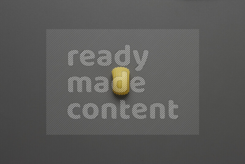 Elbow pasta on grey background