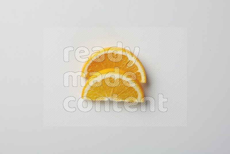Two halves of an orange slices on white background