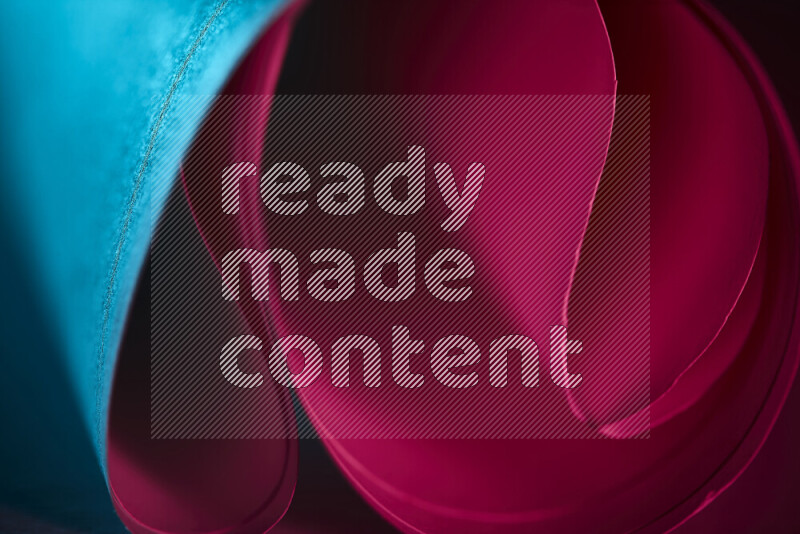 An abstract art piece displaying smooth curves in blue and red gradients created by colored light