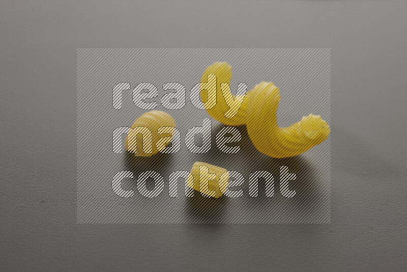 Different pasta types on grey background