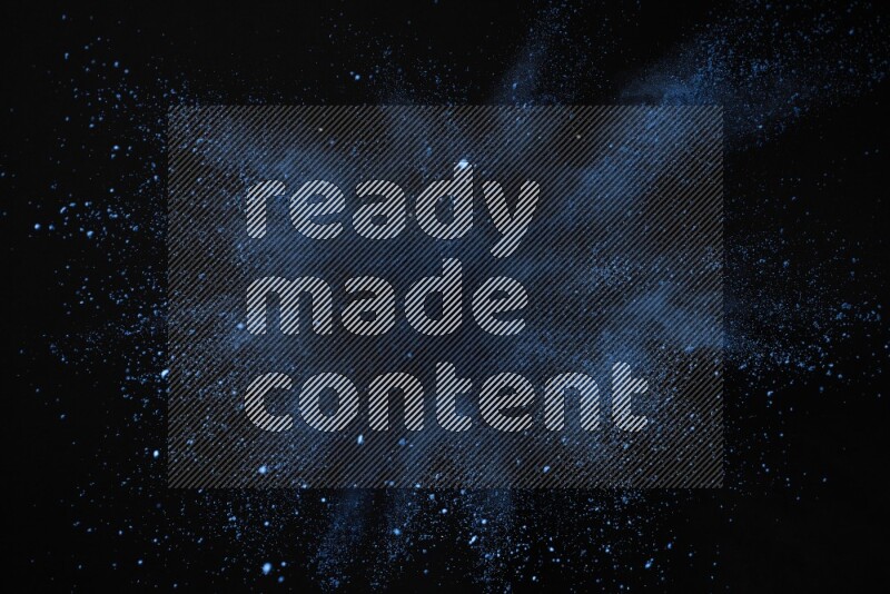 Blue powder explosion on black background