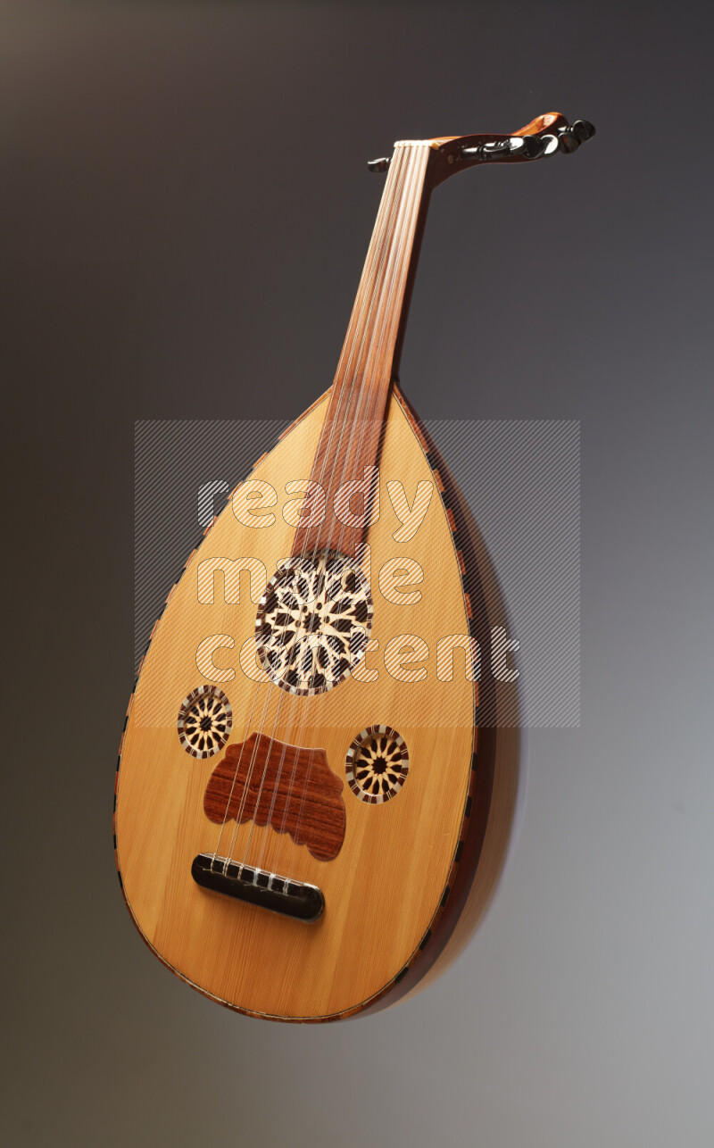 a wooden brown Oud on a gray background