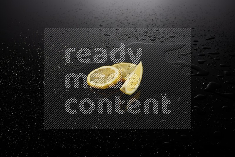 Lemon slices with water drops, and droplets on black background