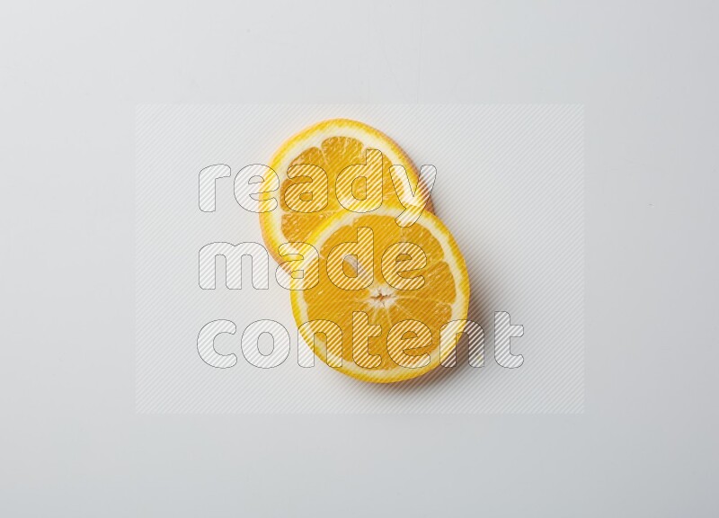 Two orange slices on white background