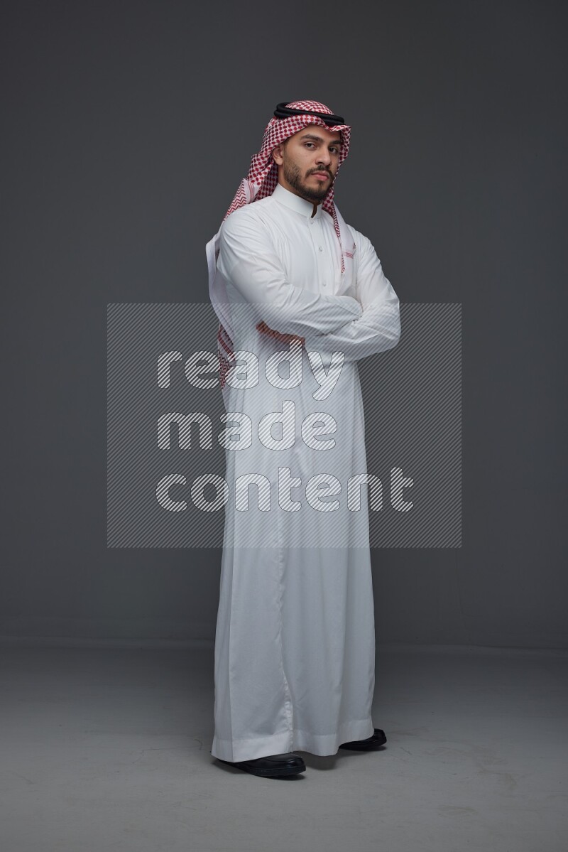 A Saudi man wearing Thobe and Shmagh standing in different poses eye level on a gray background