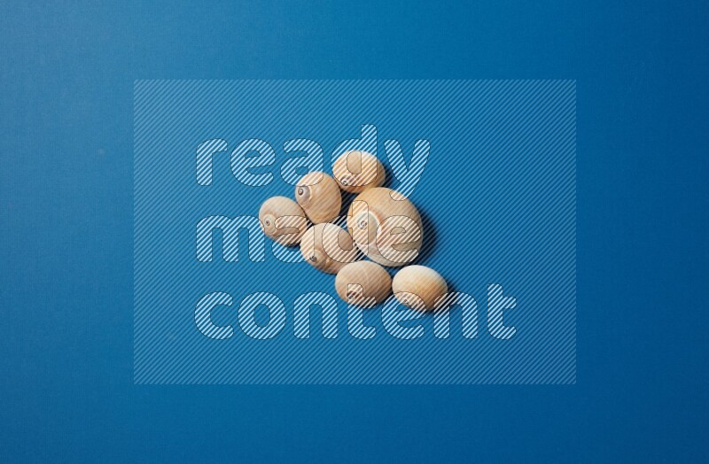 top view shot of seashells arrangement on blue background