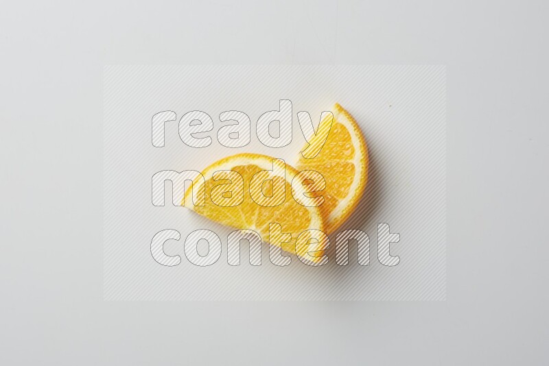 Two halves of an orange slices on white background