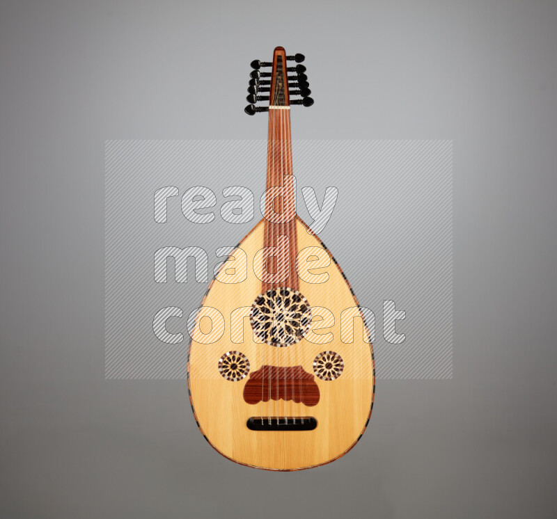 a wooden brown Oud on a gray background