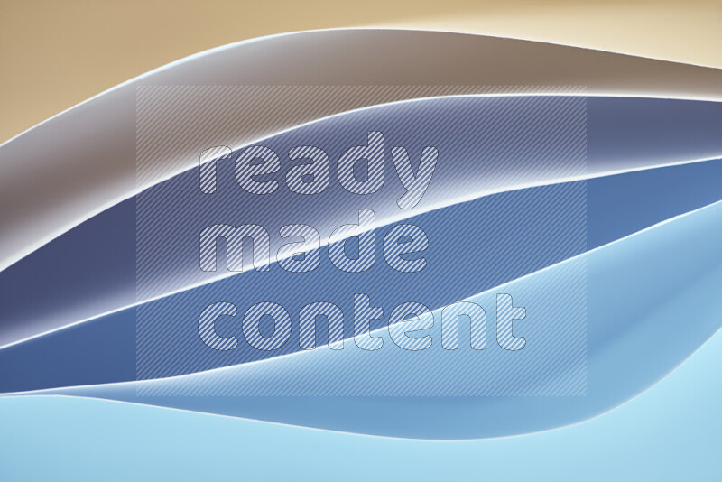 This image showcases an abstract paper art composition with paper curves in blue and yellow gradients created by colored light