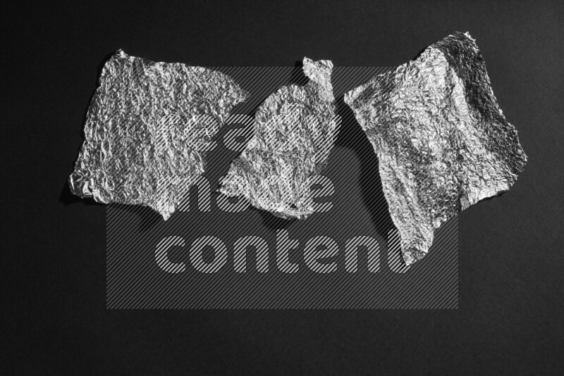 Aluminium foil on black background
