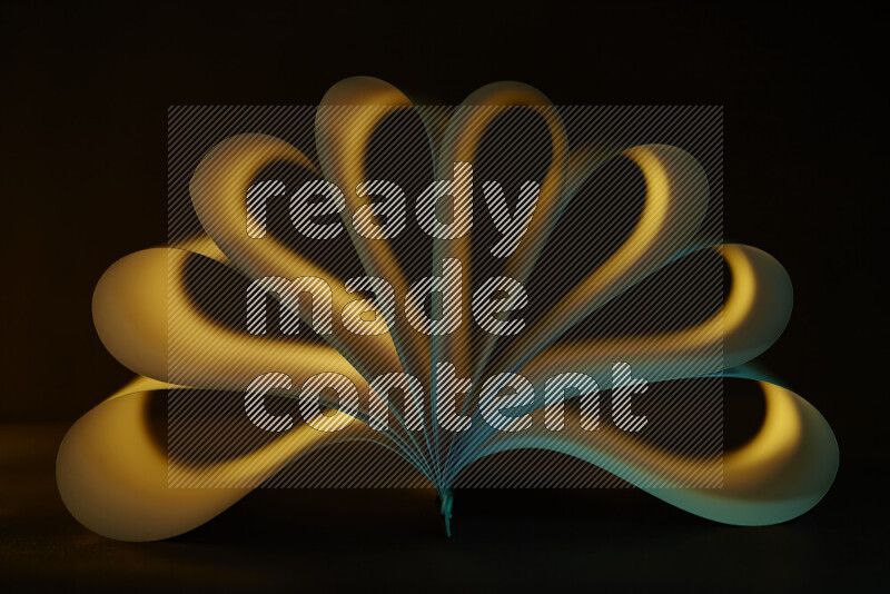 An abstract art piece displaying smooth curves in yellow and green gradients created by colored light