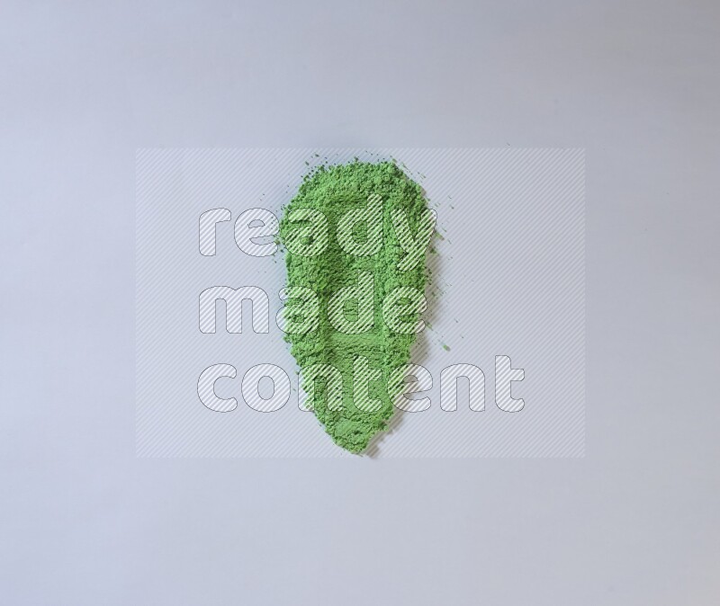 Green powder smears on white background