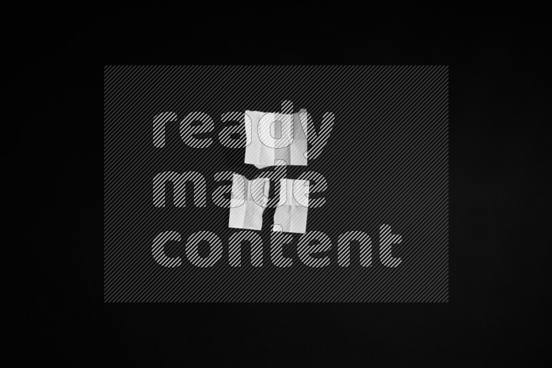 Ripped notebook sheet on black background