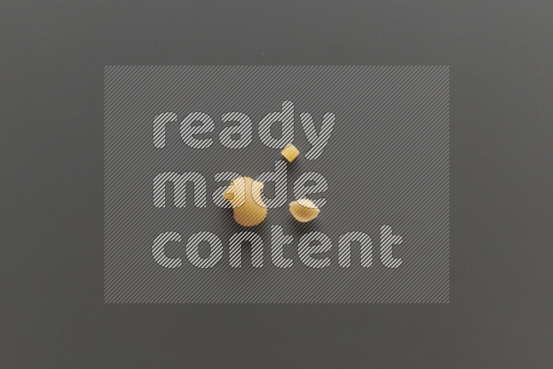 Different pasta types on grey background