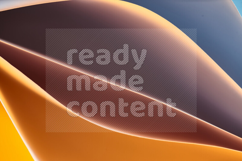 This image showcases an abstract paper art composition with paper curves in blue and orange gradients created by colored light