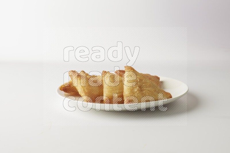 sambosas on a white background