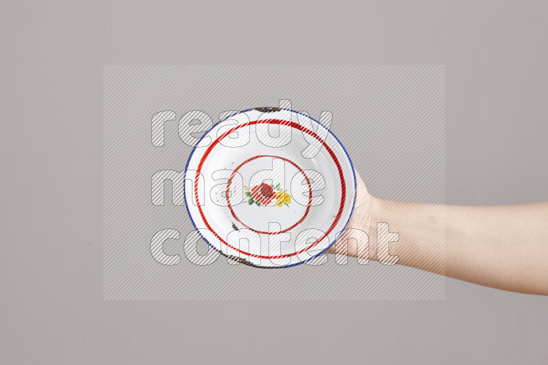 Woman hands holding different metal essentials in different positions