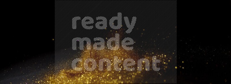 Gold glitter powder isolated on black background