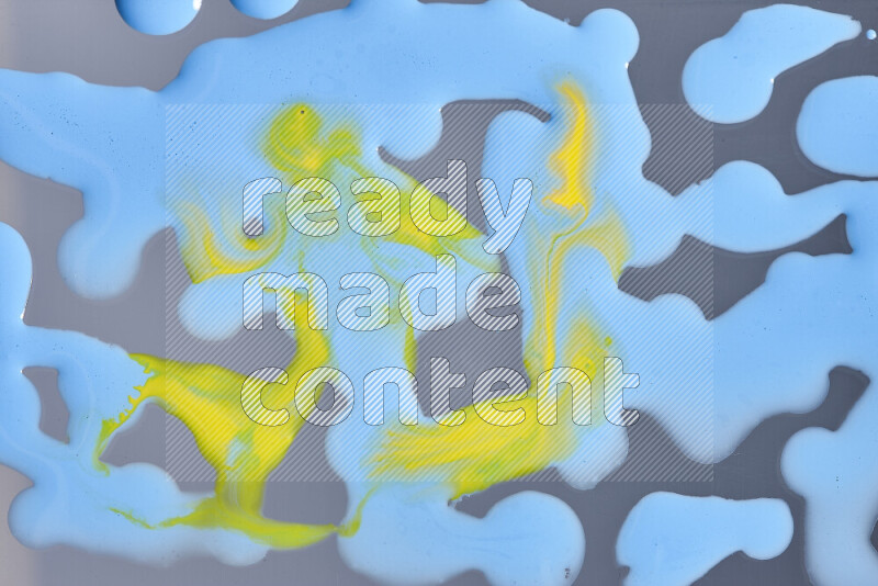 Abstract colorful background with mixed of yellow and blue paint colors