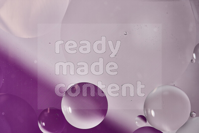 Close-ups of abstract oil bubbles on water surface in shades of white and purple