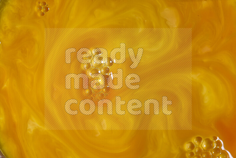 A close-up of abstract different swirling patterns in orange