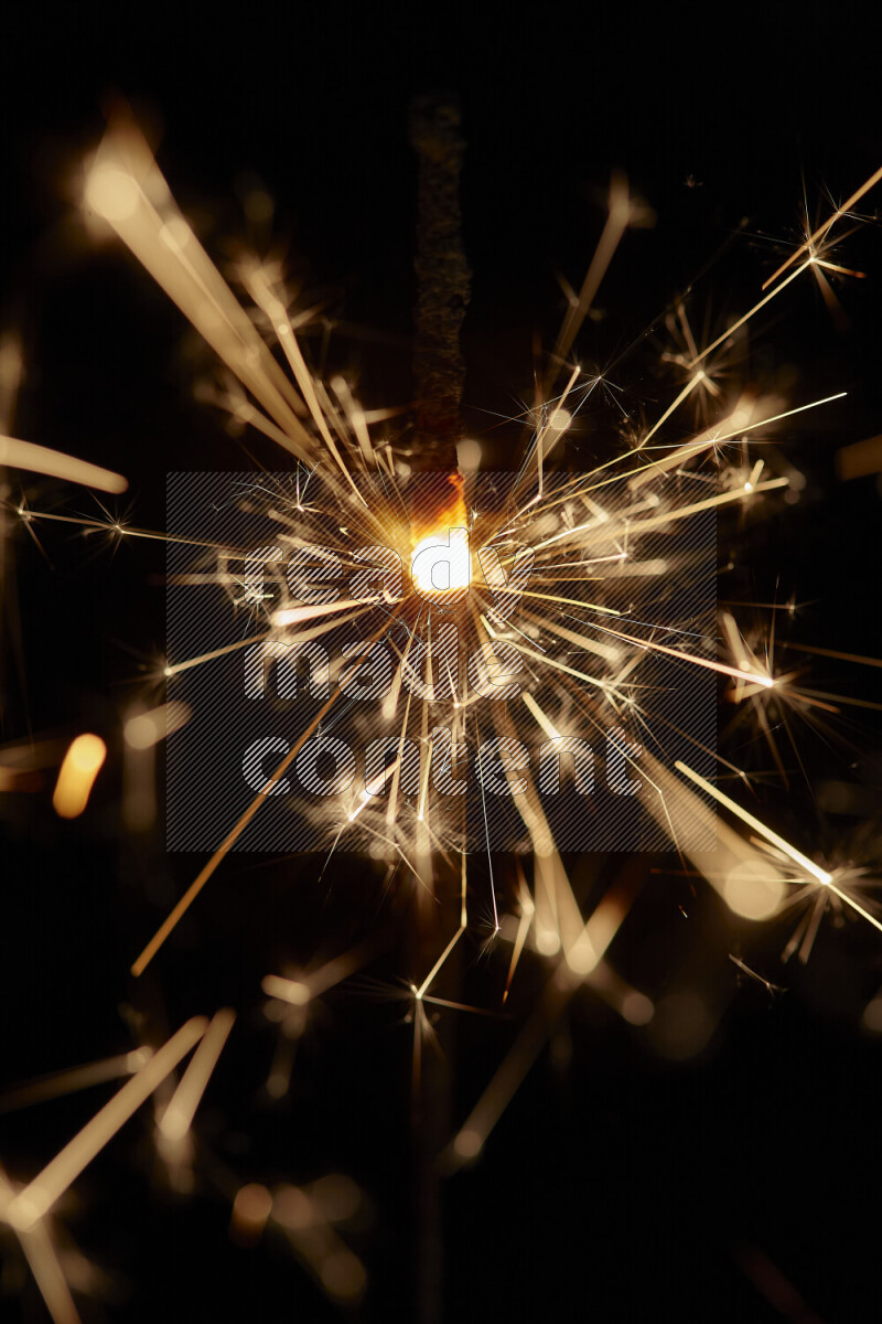 A close-up image of sparkler candle isolated on black background