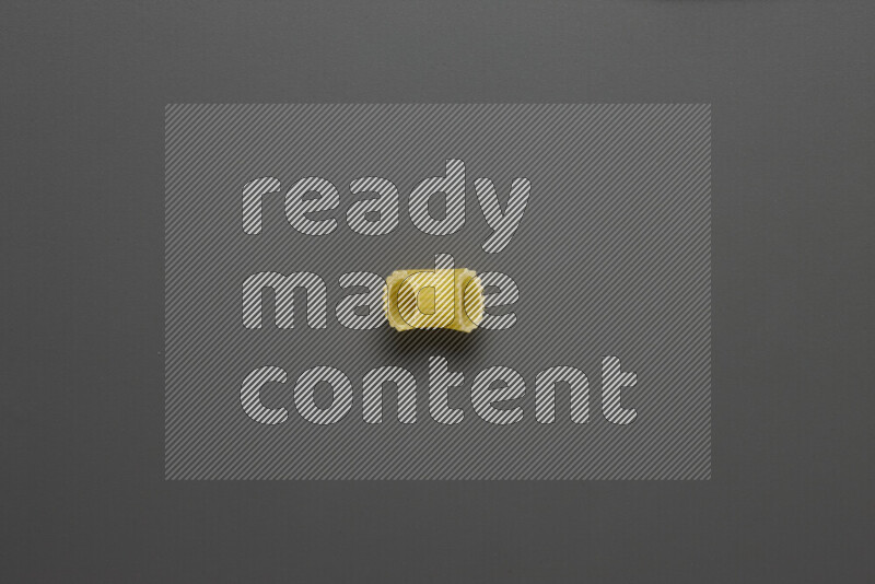 Elbow pasta on grey background