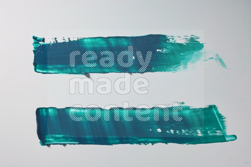 Turquoise painting knife strokes on white background