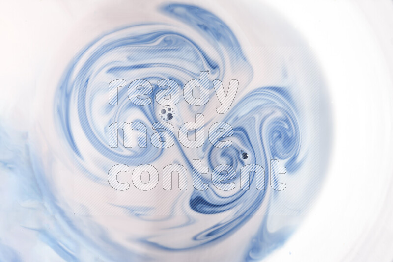 A close-up of abstract swirling patterns in blue and white