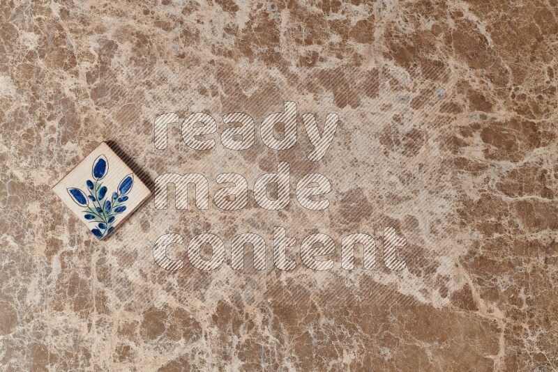 A decorative coaster on beige marble background