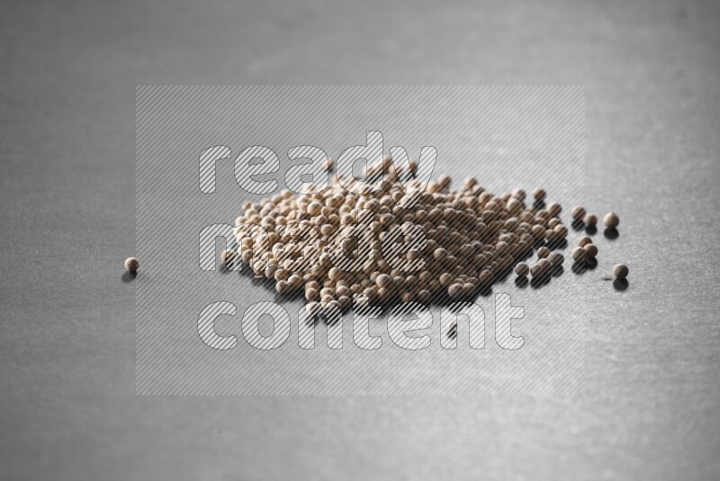 White pepper on a black flooring