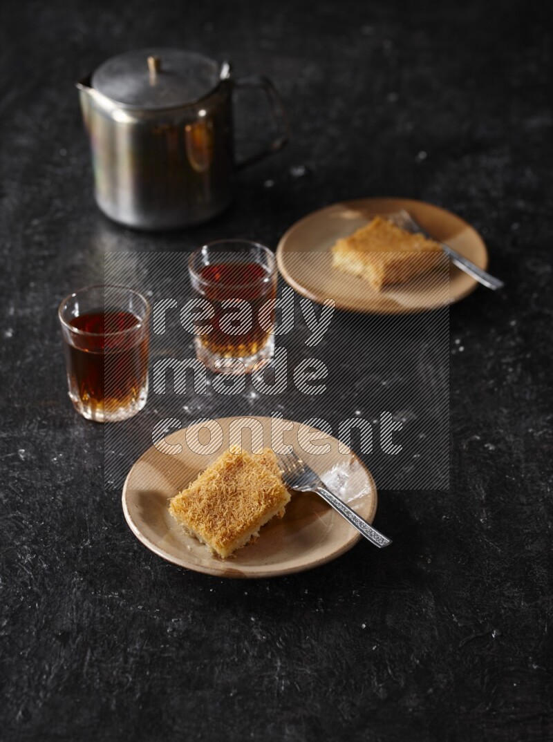 konafa with tea in a dark setup