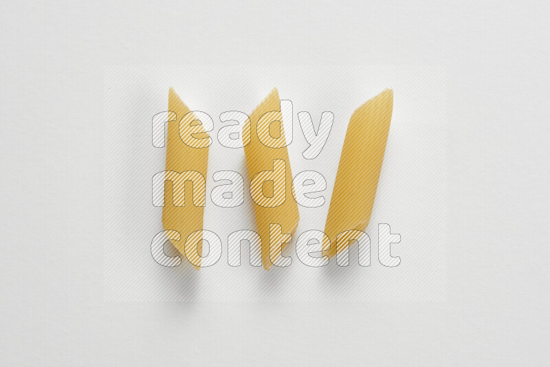 Penne pasta on white background