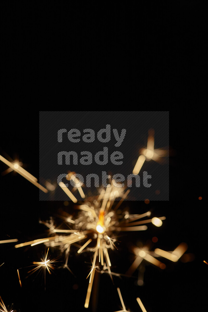 A close-up image of sparkler candle isolated on black background
