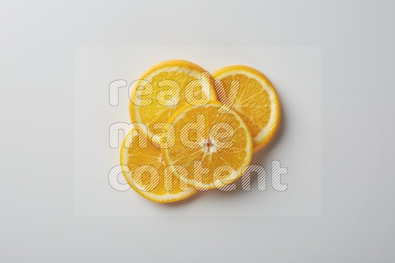 Four orange slices on a white background
