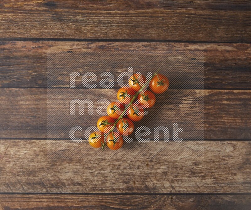 Single cherry tomato vein topview on a wooden background
