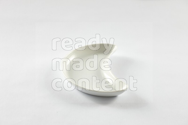 A pottery crescent plate on white background