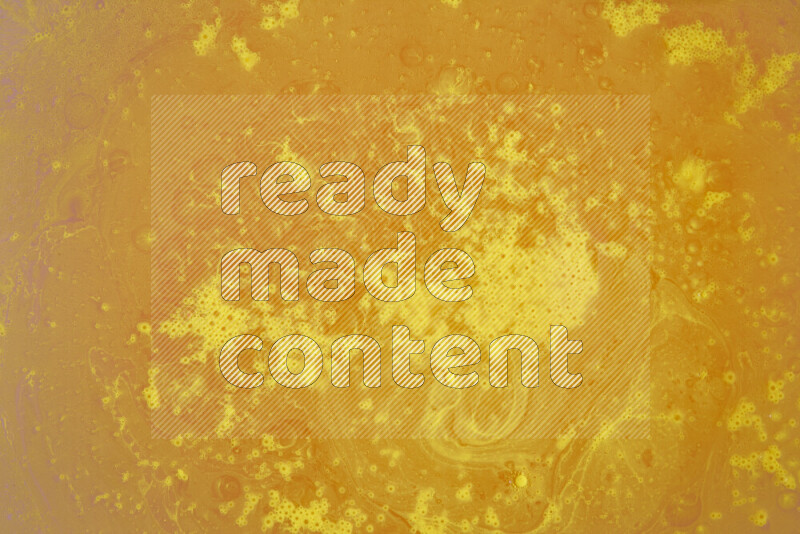 The image captures a dramatic splatter of yellow paint over a white backdrop