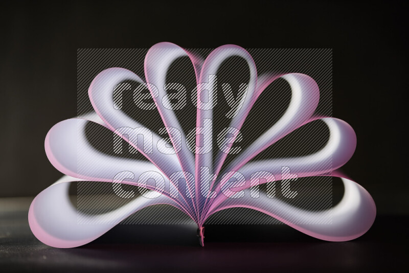 An abstract art piece displaying smooth curves in pink and white gradients created by colored light
