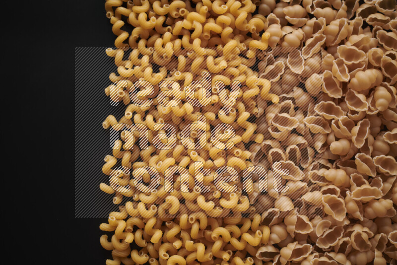 Different pasta types on black background