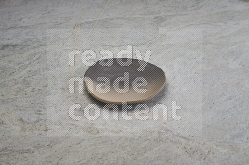 Multicolored Pottery Plate On Grey Marble Flooring