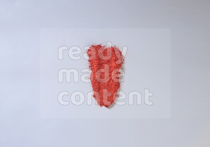 Red powder smears on white background