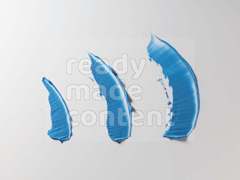 Blue painting knife strokes on white background