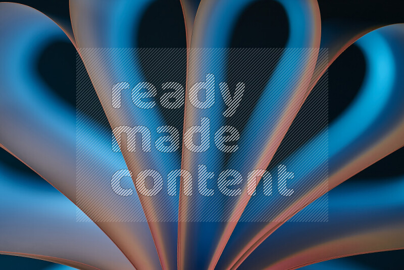 فن تجريدي يعرض منحنيات وتدرجات اللون الأزرق والبرتقالي مكونه بضوء ملون