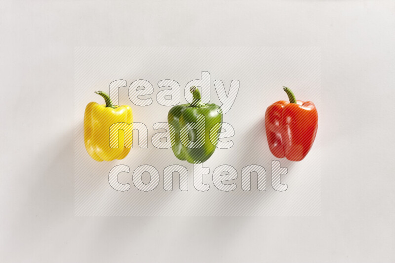 Assorted bell peppers on white background
