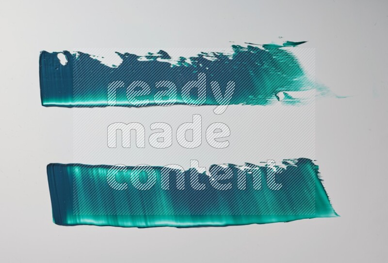 Turquoise painting knife strokes on white background