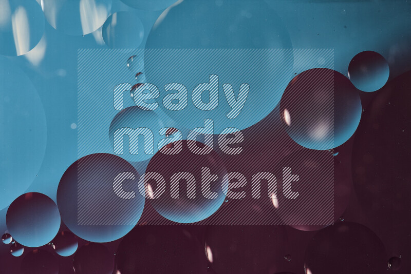 Close-ups of abstract oil bubbles on water surface in shades of blue and purple