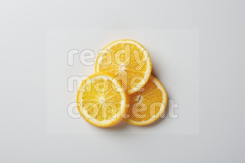 Three orange slices on a white background