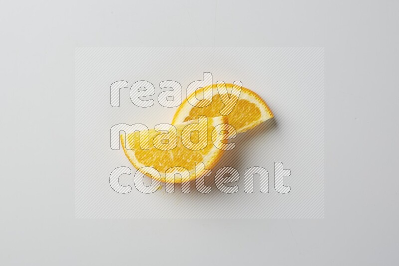 Two halves of an orange slices on white background