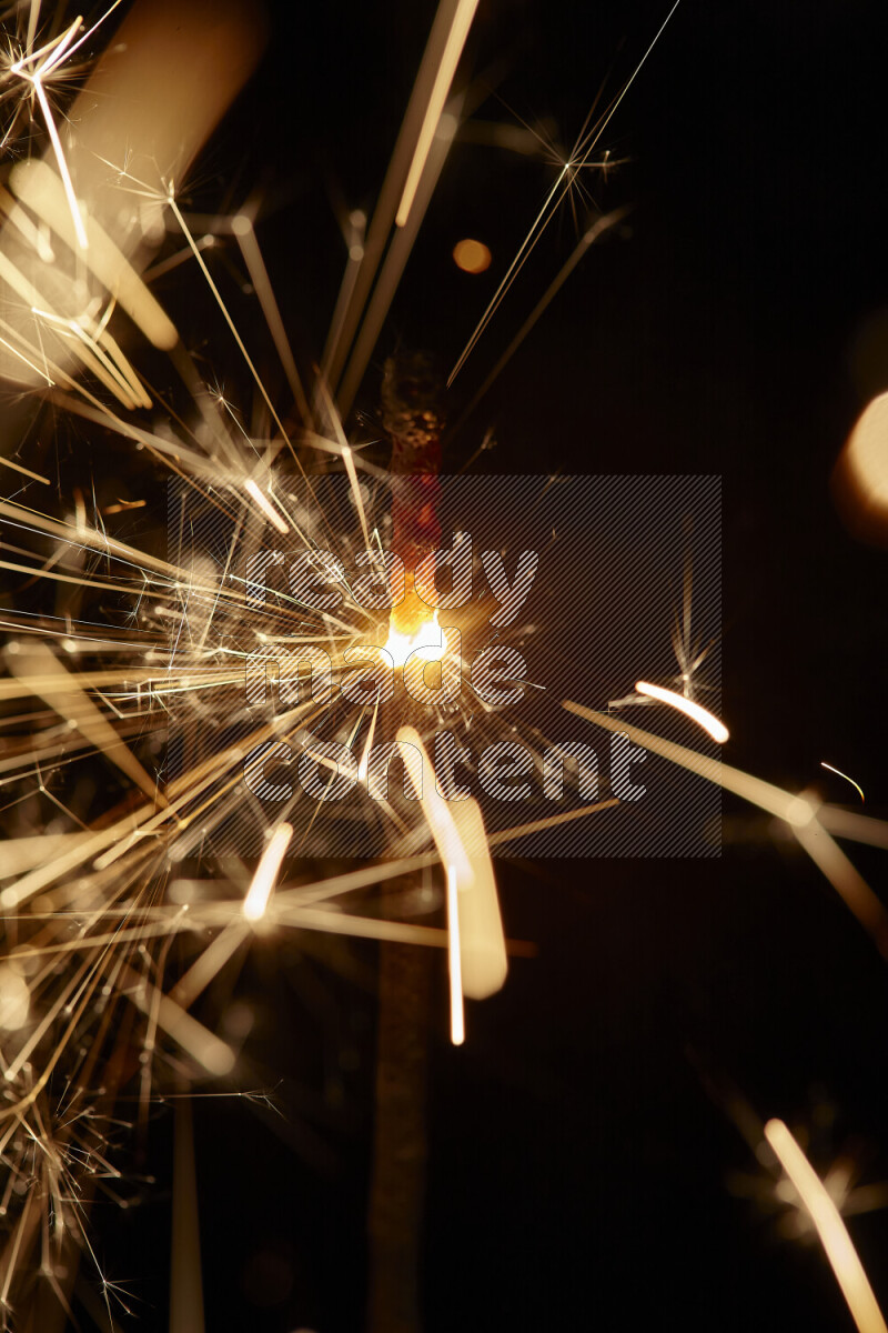 A close-up image of sparkler candle isolated on black background